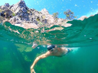 man swimming in Pactola Reservoir