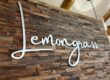 Lemongrass text on a wood textured wall